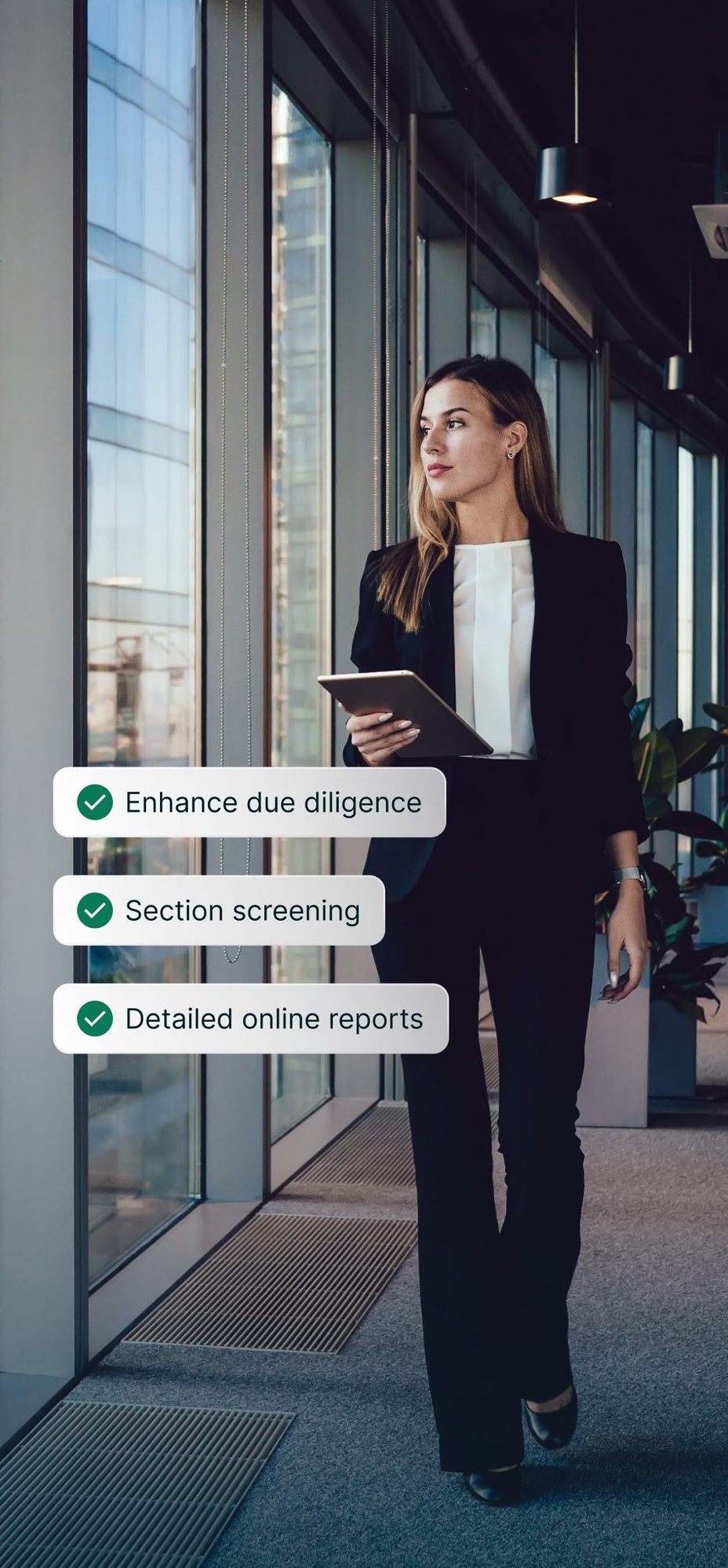 A professional walking through an office, with enhanced due diligence, sanction screening and detailed online reports passed