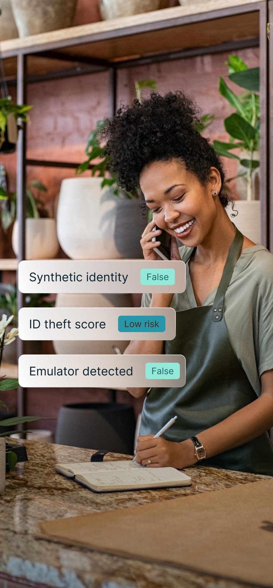 A shop owner taking a call, with synthetic identity and emulator checks returning false and a low ID theft score