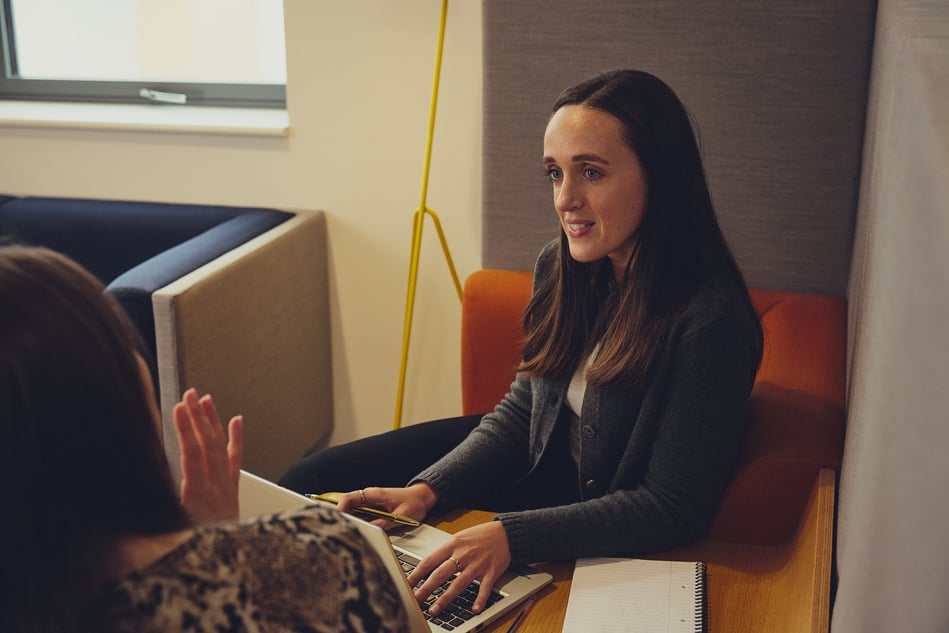 Woman SmartSearch Employee Making notes in meeting