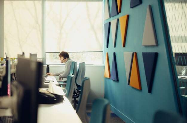 Male SmartSearch Employee on a call at workplace