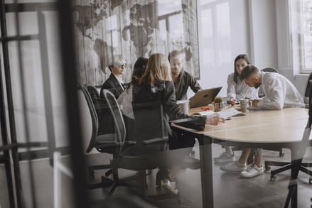 SmartSearch Employees Working In A Meeting Room