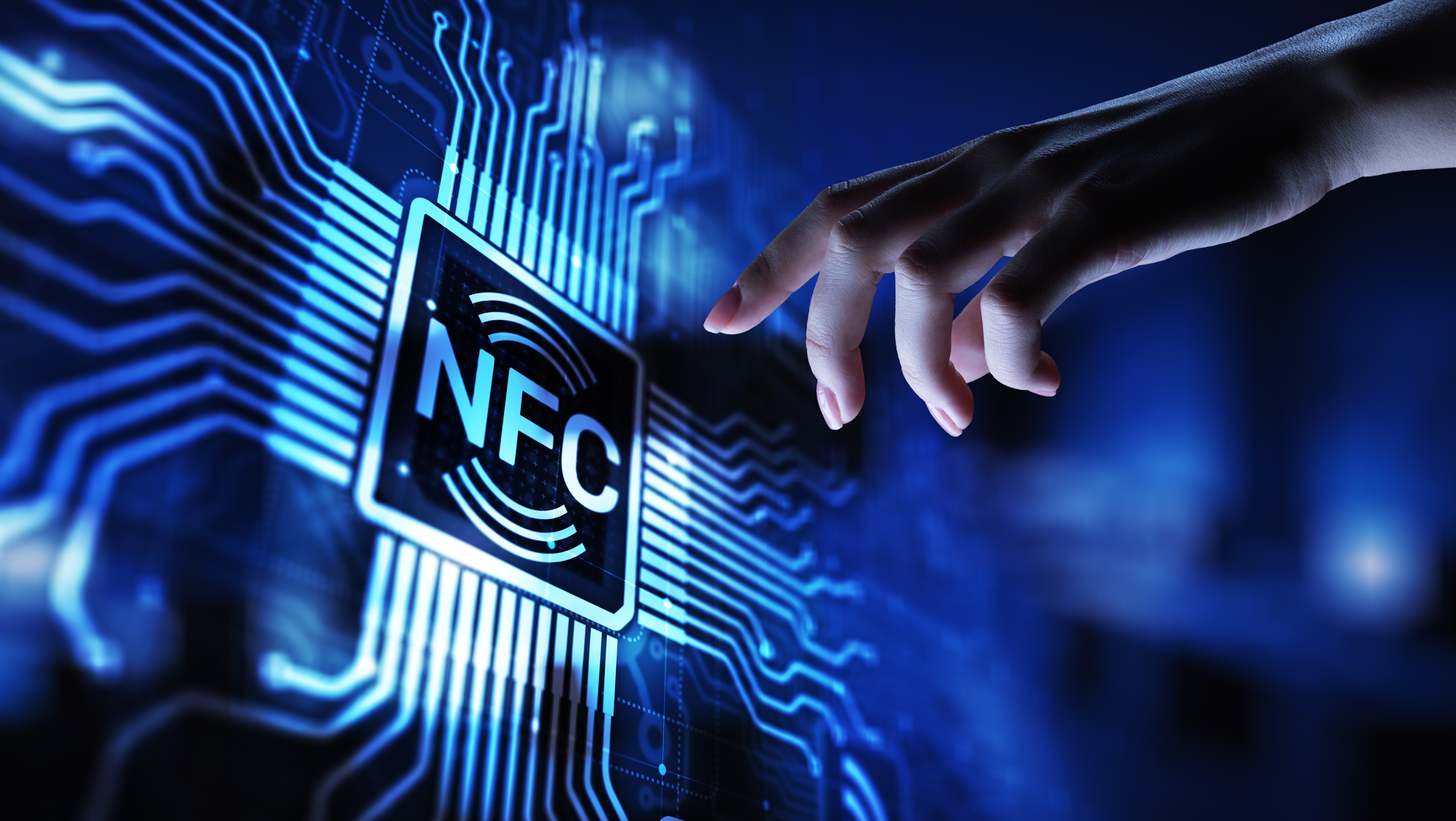 Hand reaching towards a blue NFC logo stylised as a chip with wires leading off of it from all four sides.